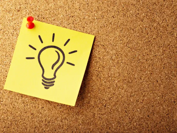 sticky note with a lightbulb drawn on it